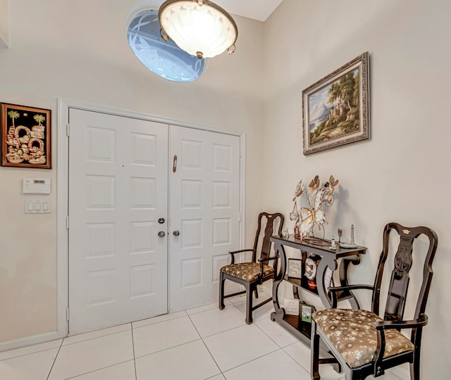 foyer featuring light tile patterned floors