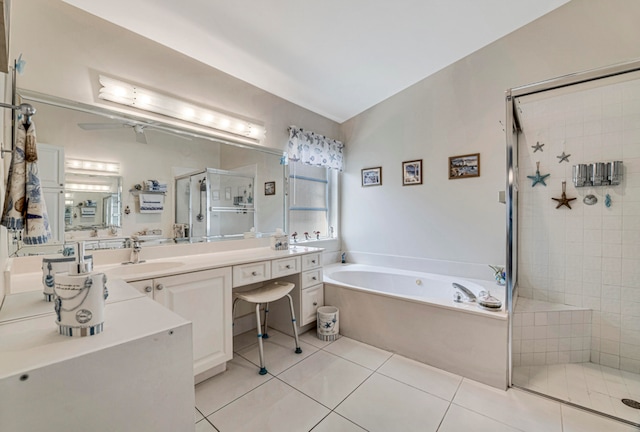 bathroom with tile patterned flooring, ceiling fan, vanity, and separate shower and tub