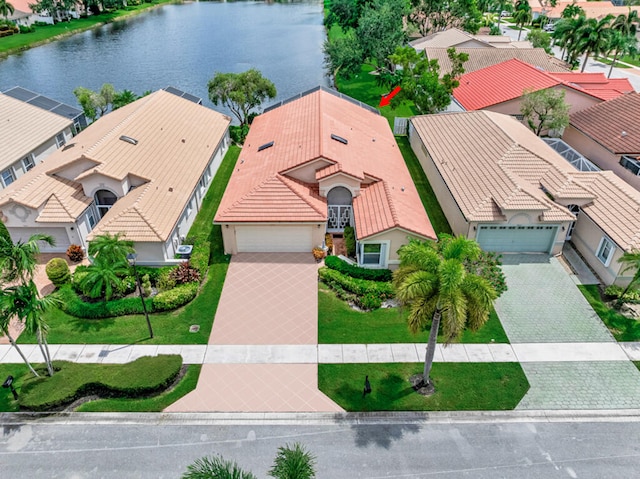 birds eye view of property featuring a water view