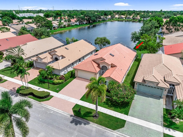 birds eye view of property with a water view