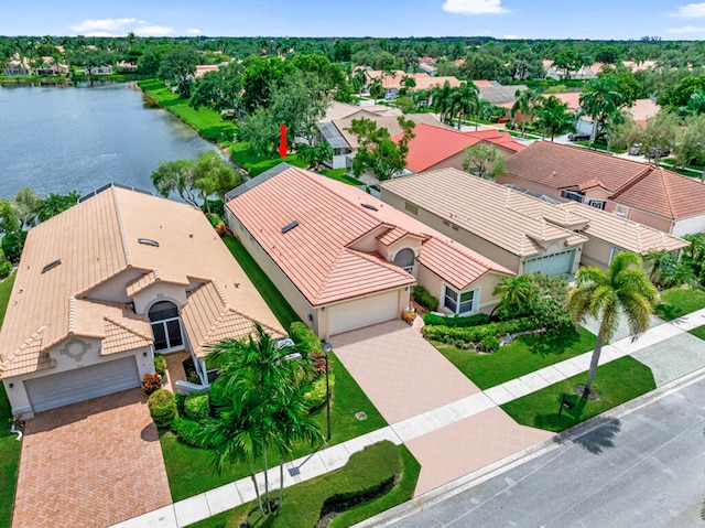 birds eye view of property with a water view