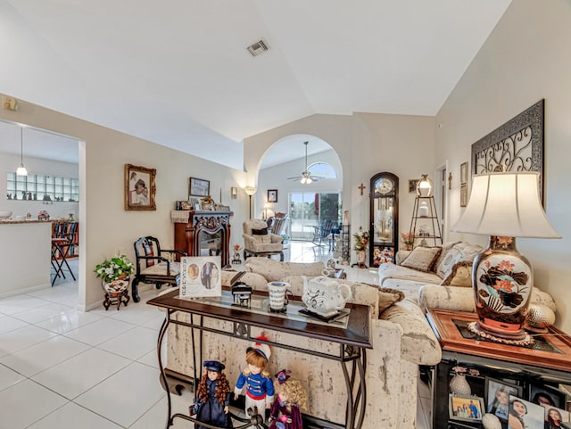 living room featuring light tile patterned floors, lofted ceiling, and ceiling fan