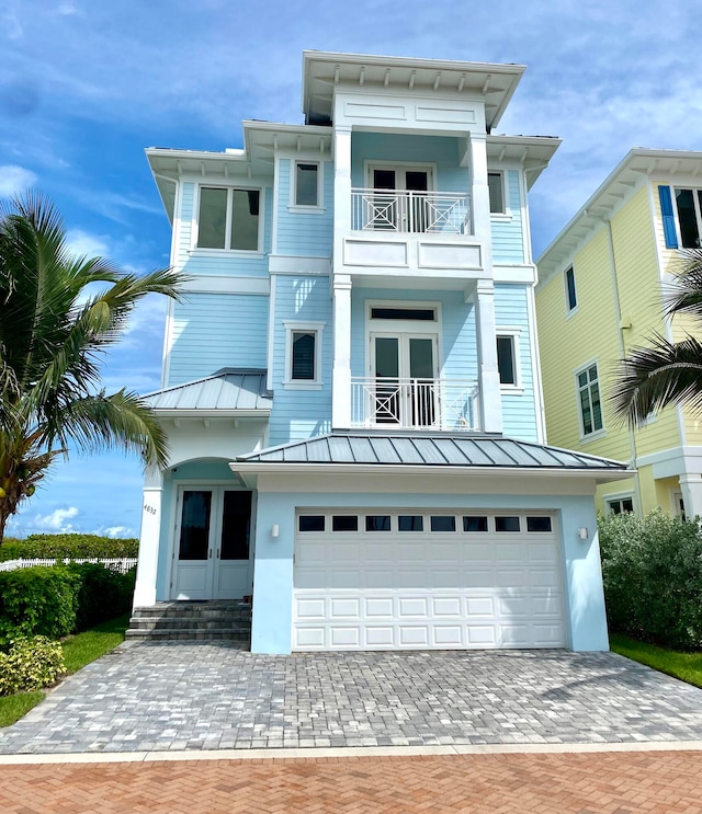 view of front of house with a balcony and a garage