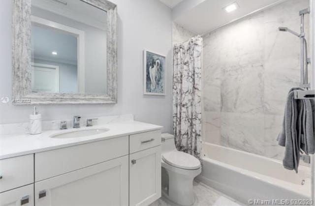 bathroom with shower / bath combination with curtain, vanity, and toilet