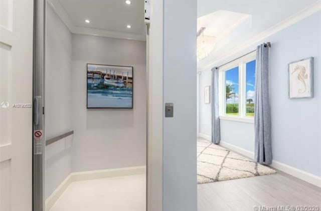 hall with recessed lighting, baseboards, ornamental molding, and wood finished floors