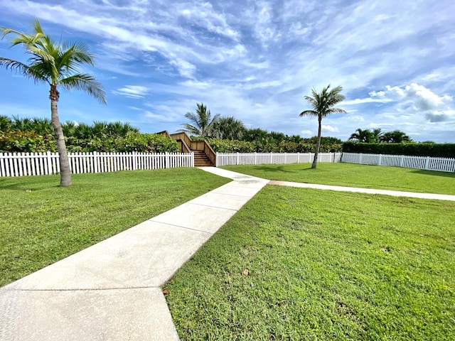 view of yard with stairs and fence private yard