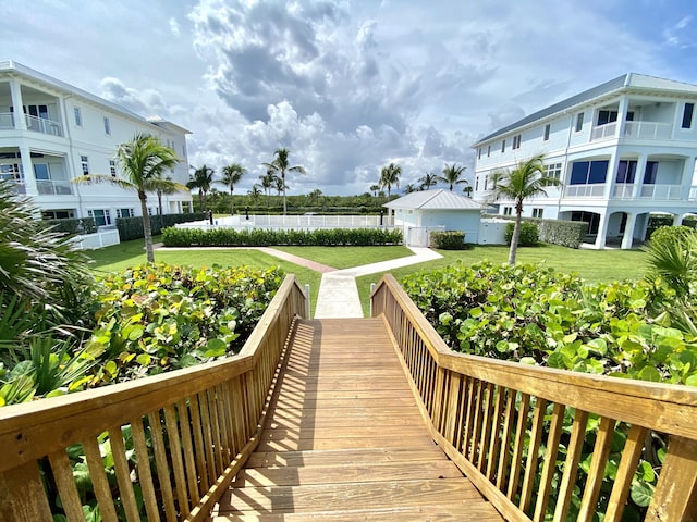 view of property's community featuring a yard