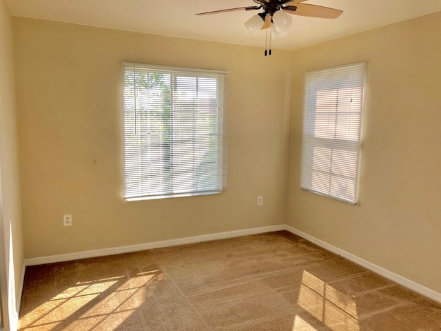 carpeted empty room with ceiling fan