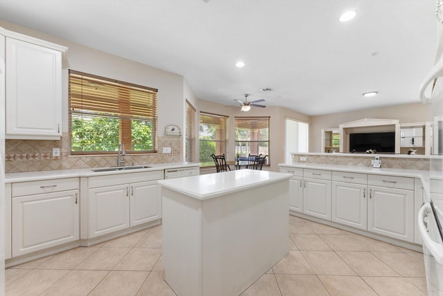 kitchen featuring white cabinetry and ceiling fan