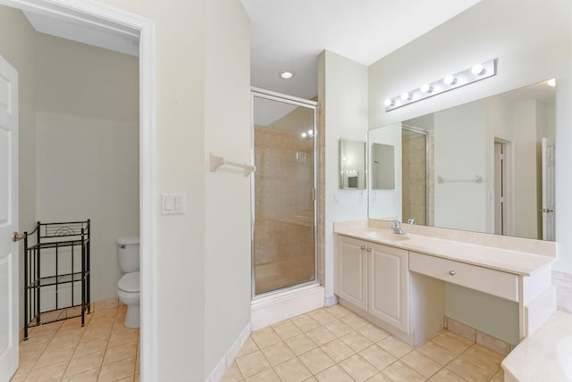 bathroom with vanity, a shower with shower door, toilet, and tile patterned flooring