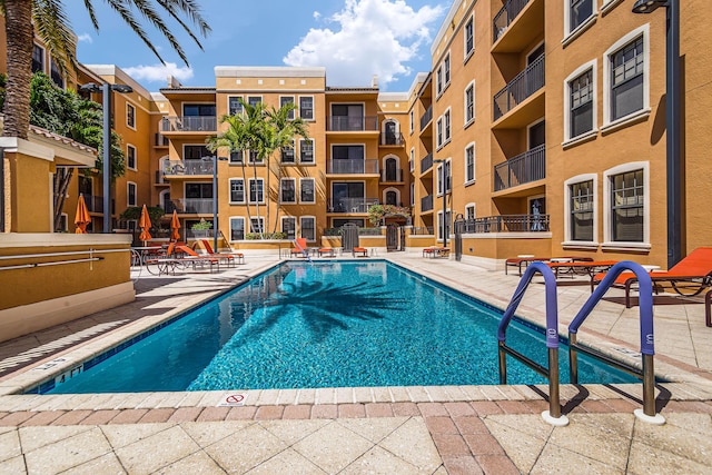 view of pool featuring a patio area