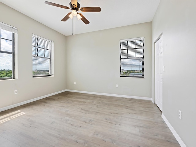 unfurnished room featuring light hardwood / wood-style floors and ceiling fan