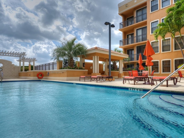 view of pool with a pergola