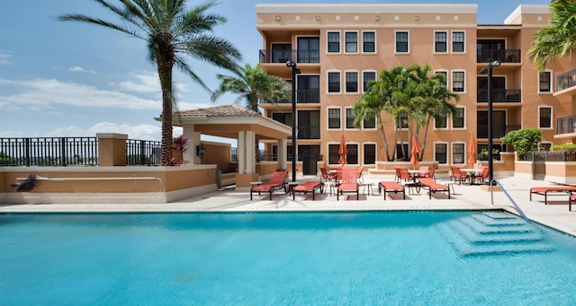 view of swimming pool with a patio area