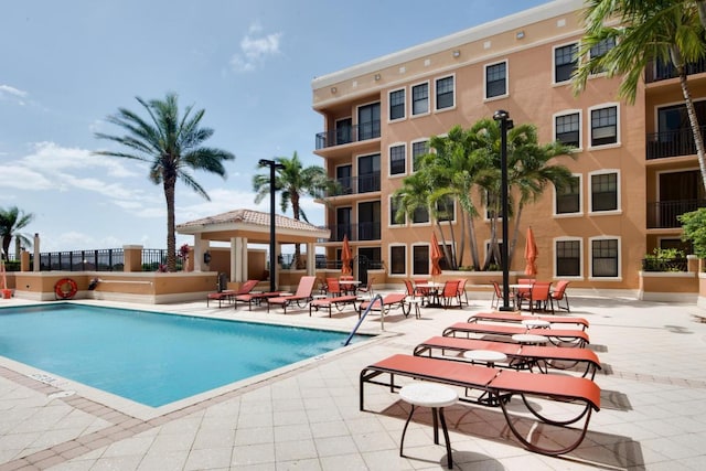 view of swimming pool with a patio area