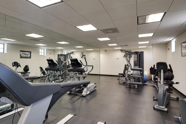 workout area with a paneled ceiling