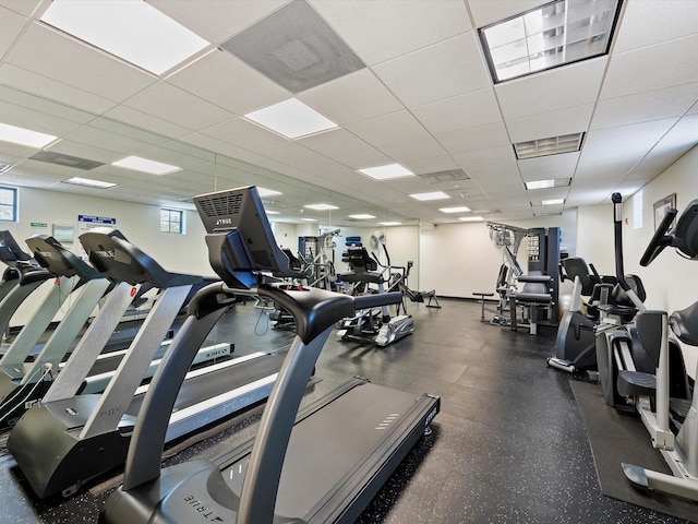 workout area featuring a paneled ceiling