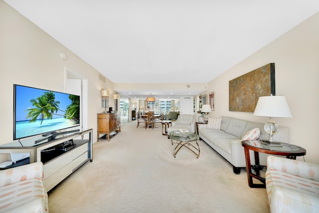 living room featuring light carpet