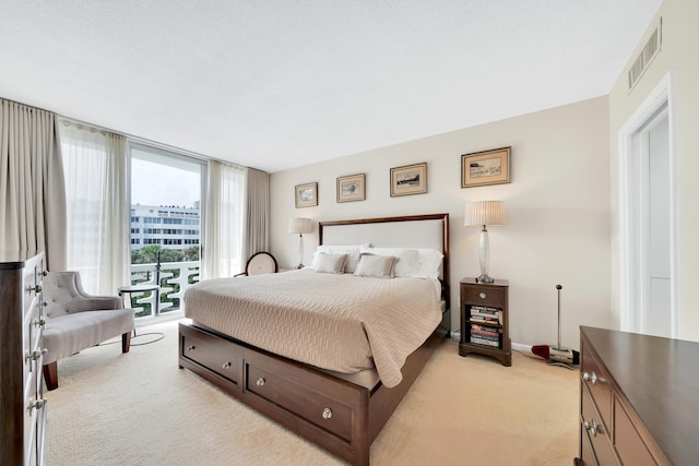 carpeted bedroom featuring a textured ceiling