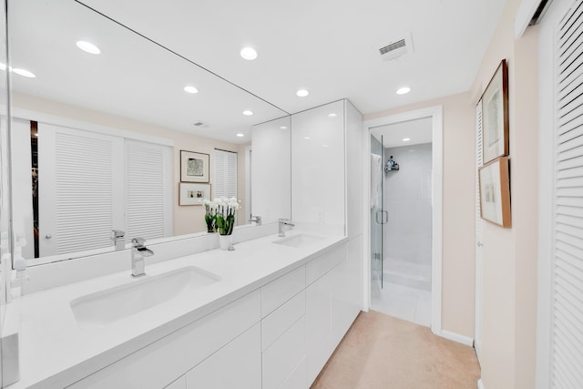 bathroom featuring vanity and an enclosed shower