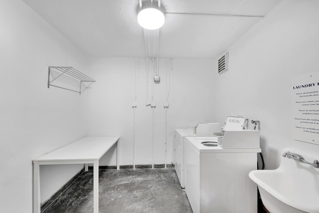 laundry area featuring separate washer and dryer and sink