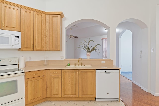 kitchen with white appliances, light hardwood / wood-style flooring, sink, light brown cabinets, and ceiling fan