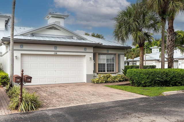 view of front of property featuring a garage