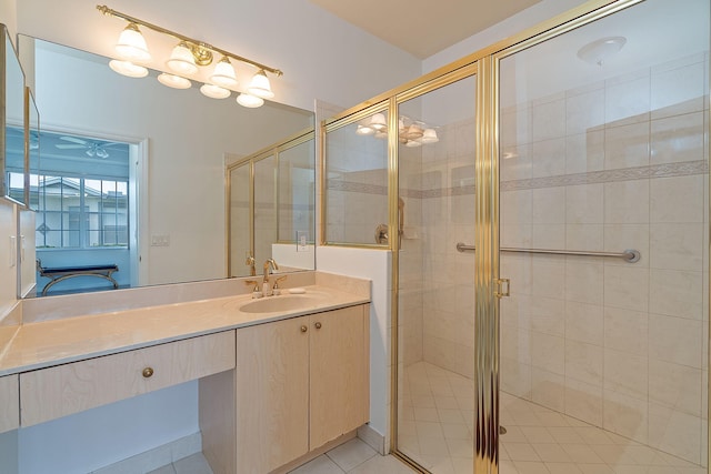 bathroom with vanity, an enclosed shower, and tile patterned floors