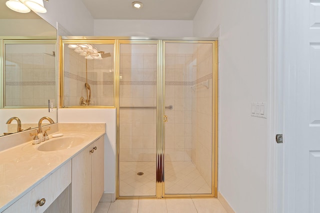 bathroom featuring vanity, tile patterned floors, and walk in shower