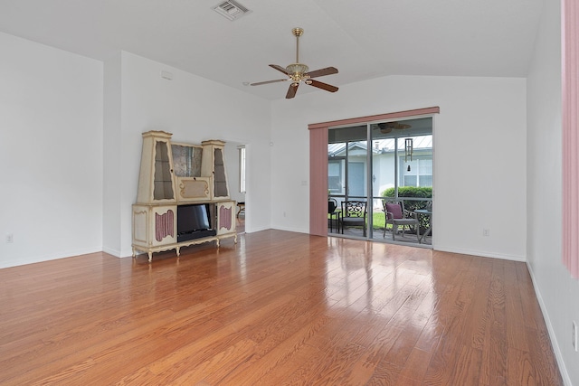 empty room featuring lofted ceiling, ceiling fan, and wood-type flooring