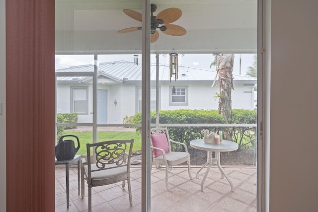 sunroom / solarium with ceiling fan and plenty of natural light