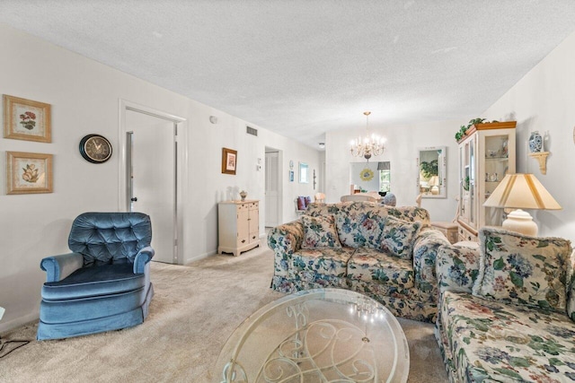 living room featuring light colored carpet, a chandelier, and a textured ceiling