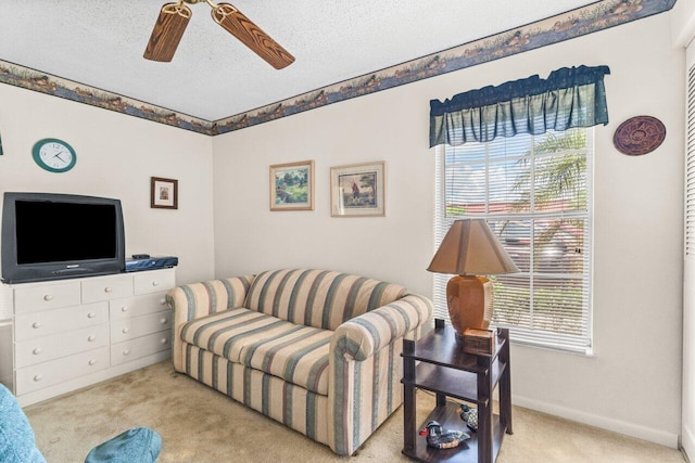 282 Cape Cod Cir Unit A, Lake Worth, FL 33467 - living room featuring carpet floors, ceiling fan, a textured ceiling, and baseboards