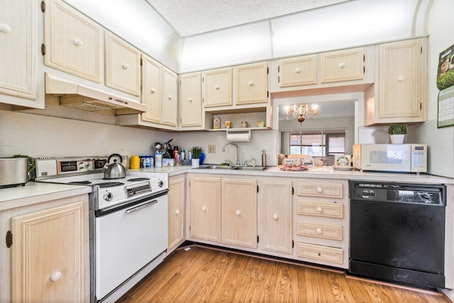 282 Cape Cod Cir Unit A, Lake Worth, FL 33467 - kitchen with white appliances, a sink, under cabinet range hood, and light countertops