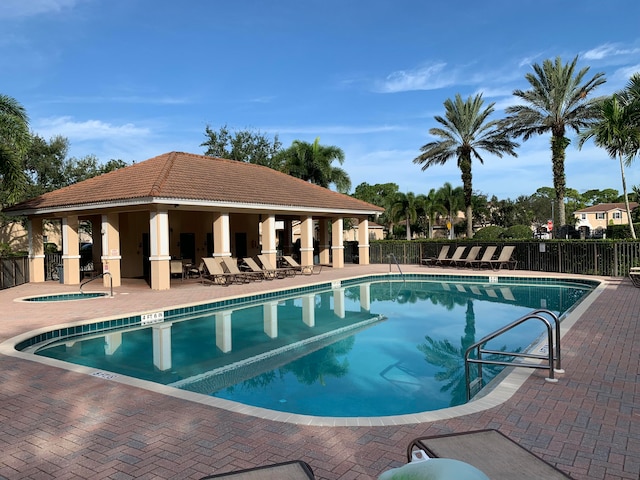 view of swimming pool with a patio