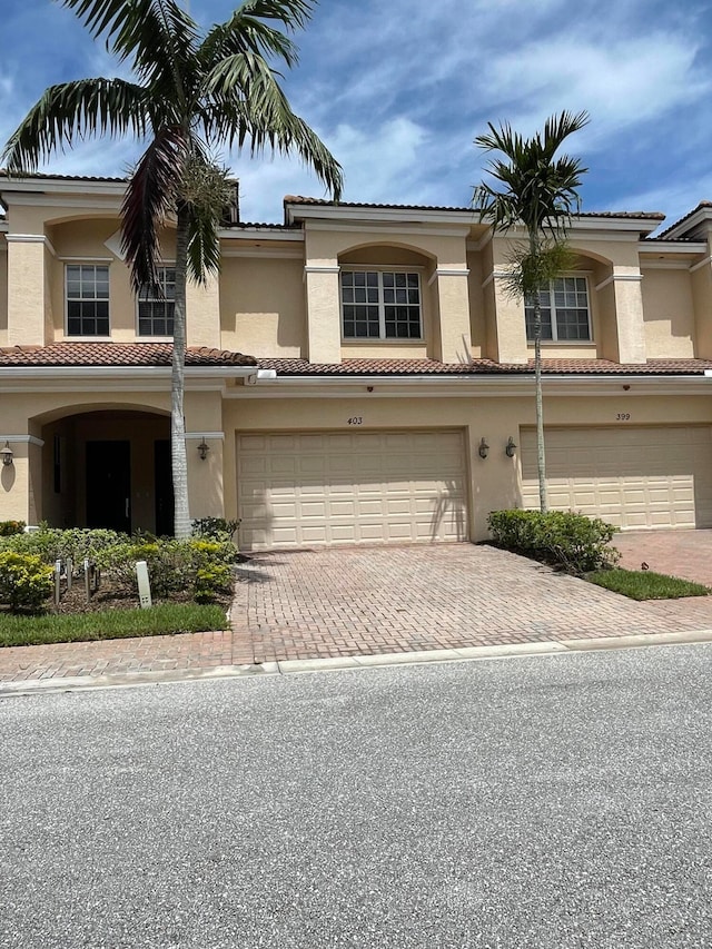 mediterranean / spanish house featuring a garage