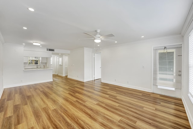 unfurnished living room with ceiling fan, light hardwood / wood-style flooring, and crown molding