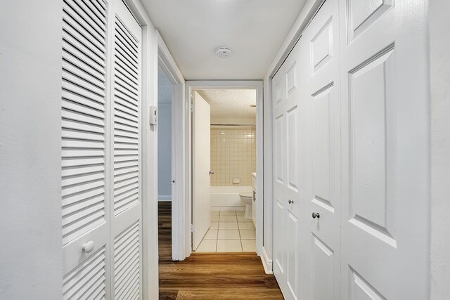 hallway with wood finished floors