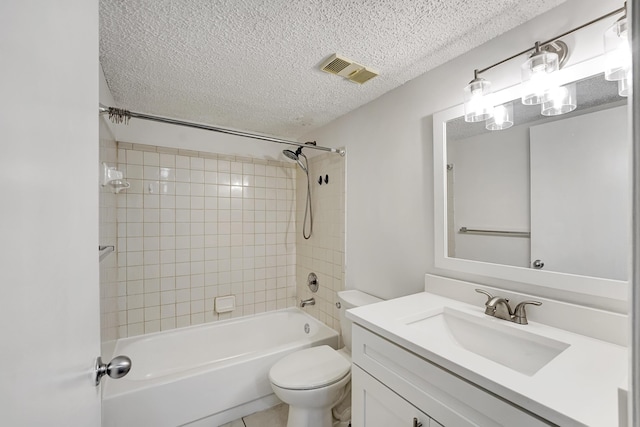 full bath featuring visible vents, toilet, a textured ceiling, vanity, and shower / bath combination