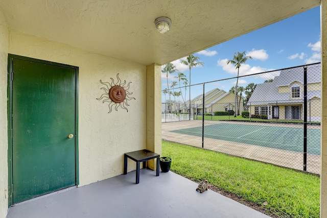 view of patio featuring a residential view and fence