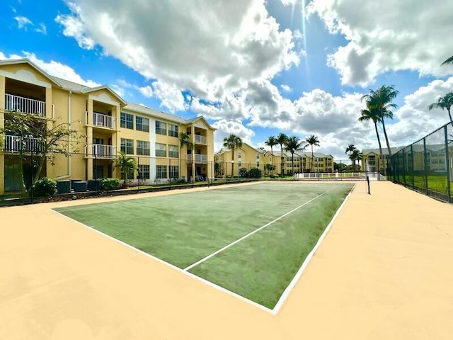 view of tennis court with fence
