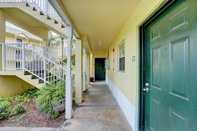 view of exterior entry featuring a patio area