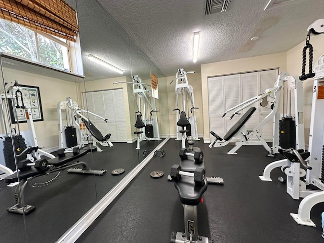 gym with a textured ceiling