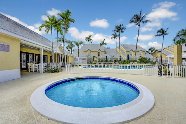 view of swimming pool with a patio area