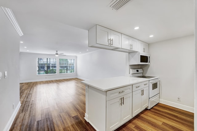 kitchen featuring wood-type flooring, white appliances, ceiling fan, and white cabinetry