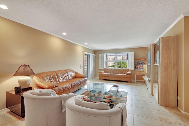 tiled living room featuring ornamental molding and a textured ceiling