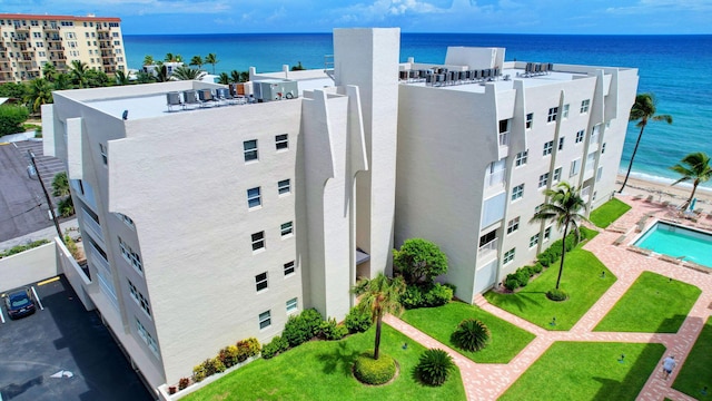 birds eye view of property with a water view