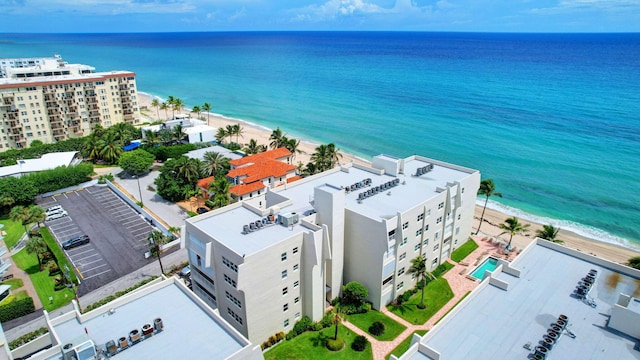 bird's eye view featuring a view of the beach and a water view