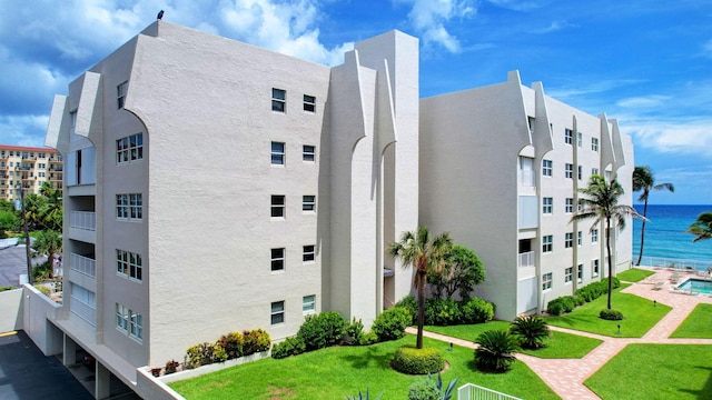 view of building exterior featuring a water view