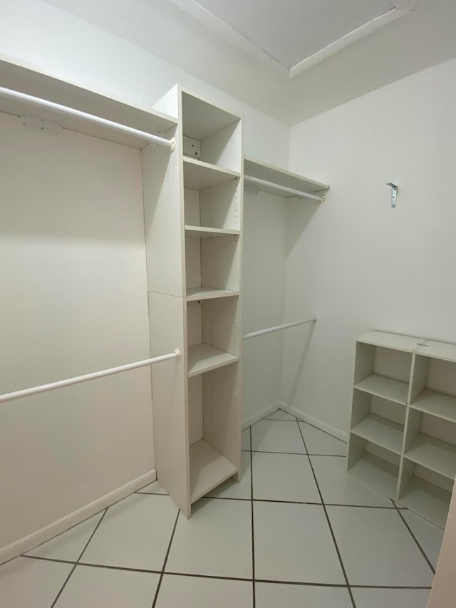 walk in closet featuring light tile patterned floors